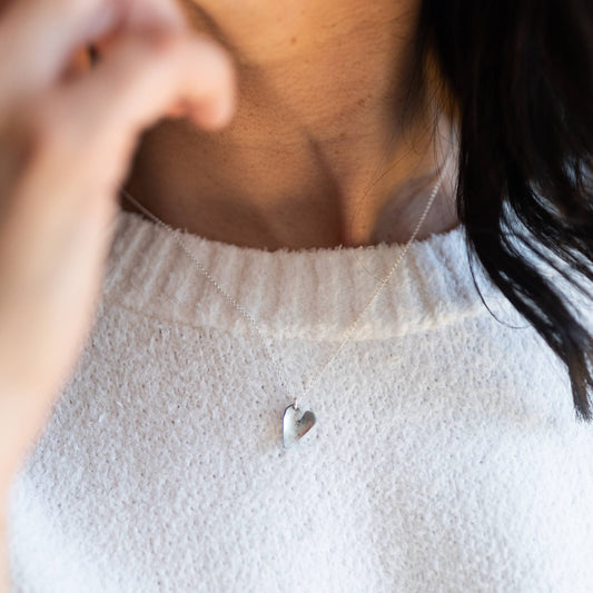 Heart necklace by Mend on the Move.Jewelry created from auto parts by abuse survivors in Detroit, Michigan.