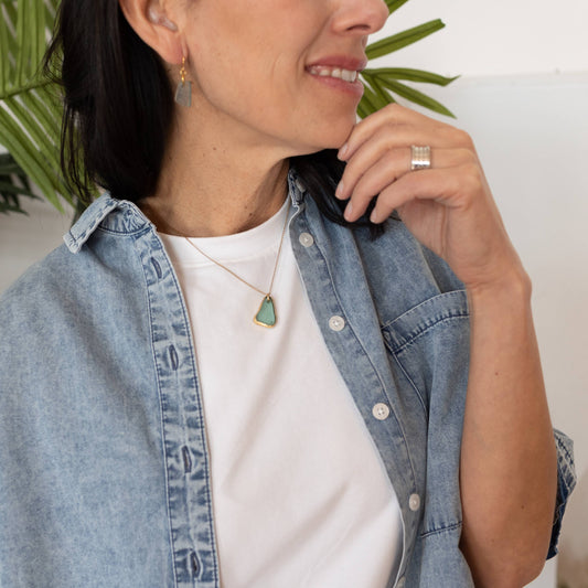 Necklace and earrings by Mend on the Move.Jewelry created from auto parts by abuse survivors in Detroit, Michigan.