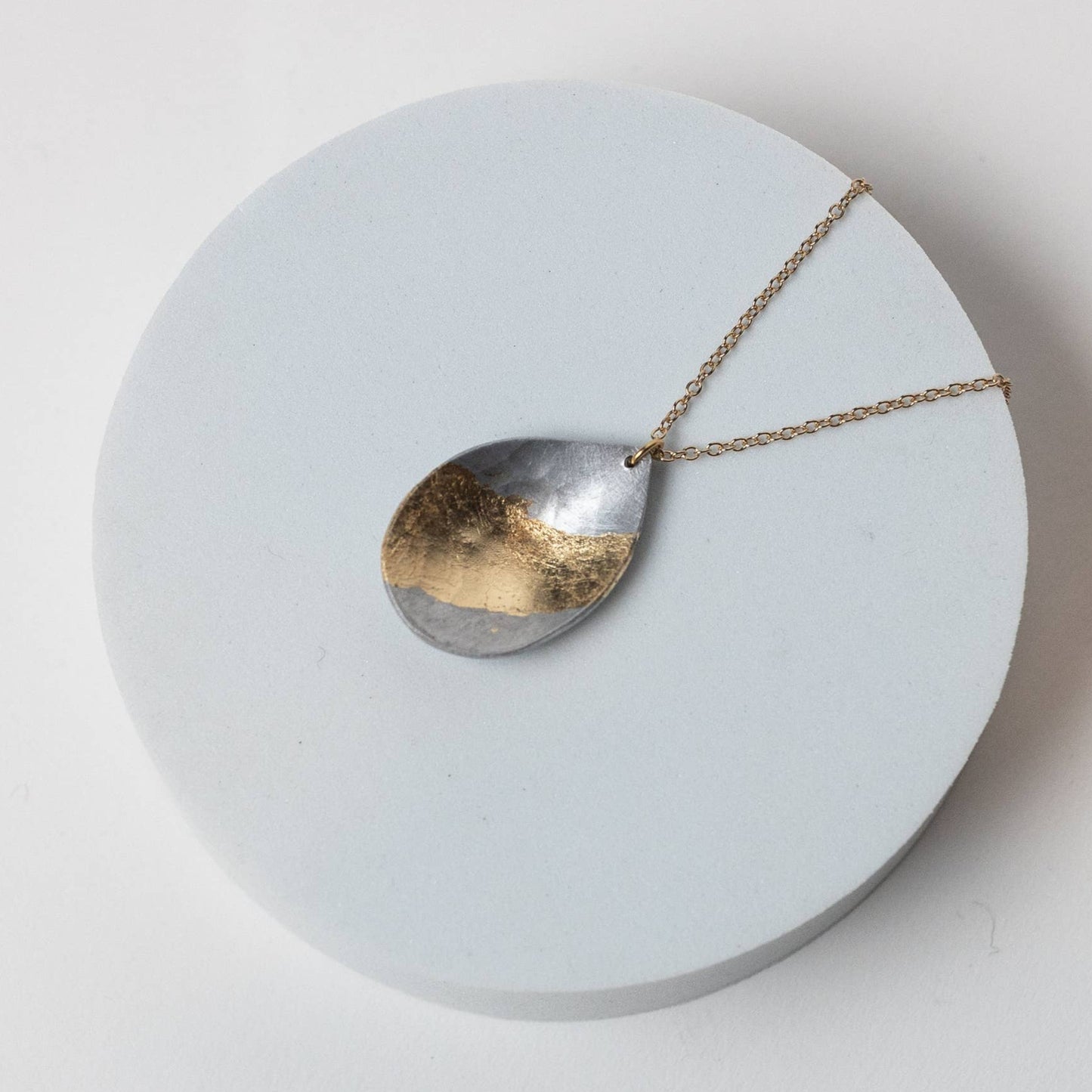 Within Aluminum Teardrop Gold Plated Necklace by Mend on the Move. Jewelry created from auto parts by abuse survivors in Detroit, Michigan.