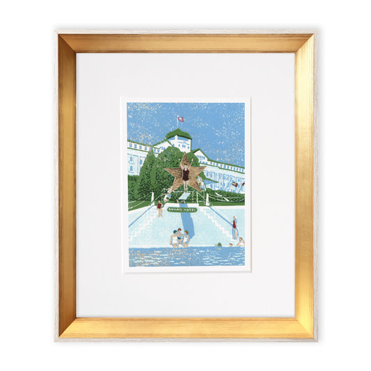 "Esther Williams, the Water Ballerina" is a 5"x7" seven-color reduction block print by Natalia Wohletz of Esther Williams on the diving board at Grand Hotel wearing a flannel red and black swimsuit made for the film, "This Time for Keeps." Framed in a gold frame with a white wood on the side.