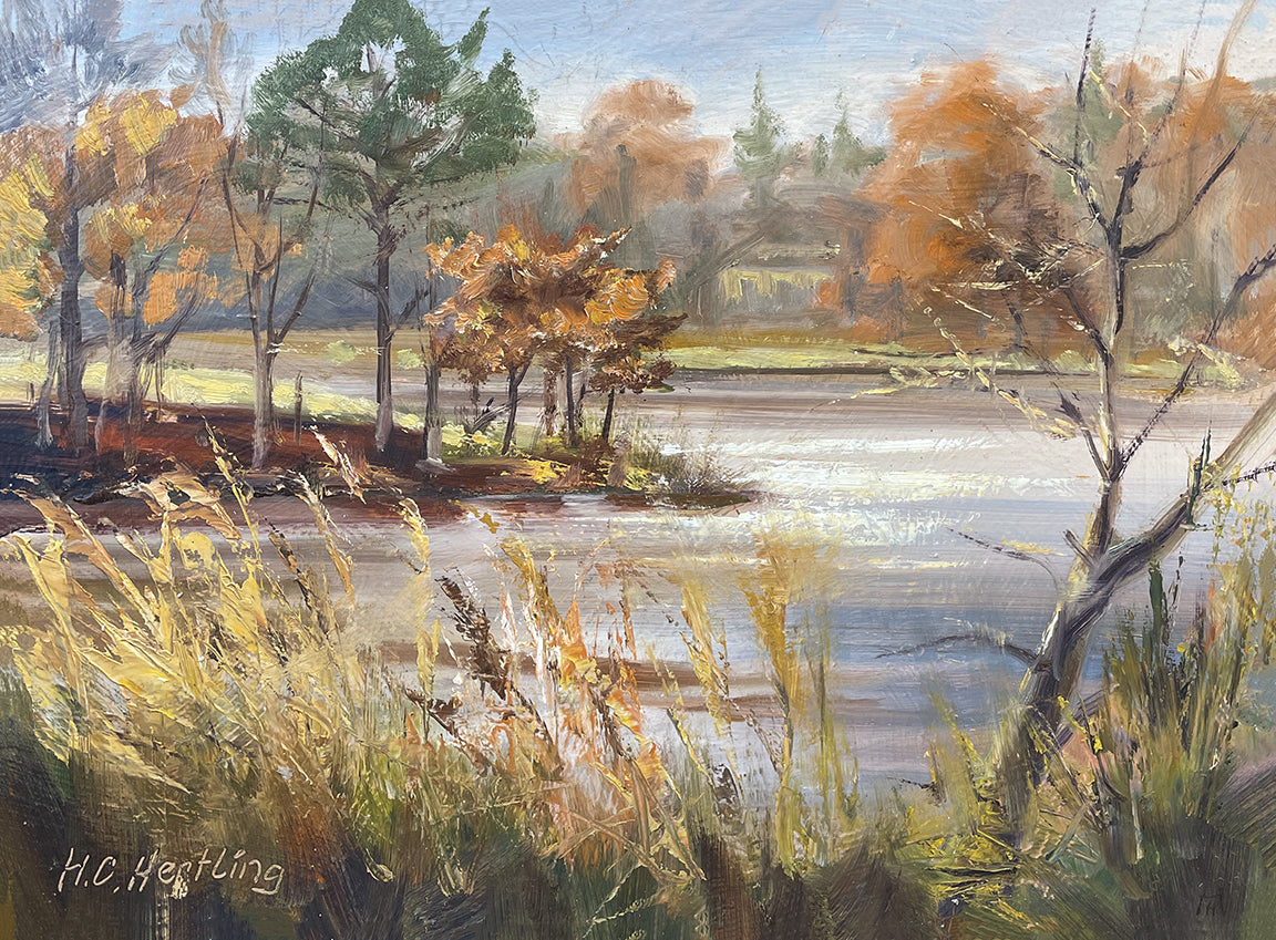 Heiner Hertling’s oil painting showcases the splash of vibrant fall colors on trees with a charming view of the lake at Kensington Metro Park.