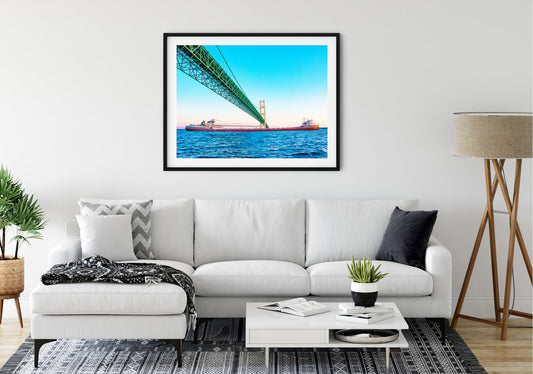 This unique perspective of a freighter traveling beneath the Mackinac Bridge by Jennifer Wohletz of Mackinac Memories evokes a sense of wonder at the bridge's strength and regional importance. The Mighty Mac spans across the Great Lakes to connect Michigan's upper and lower peninsulas.