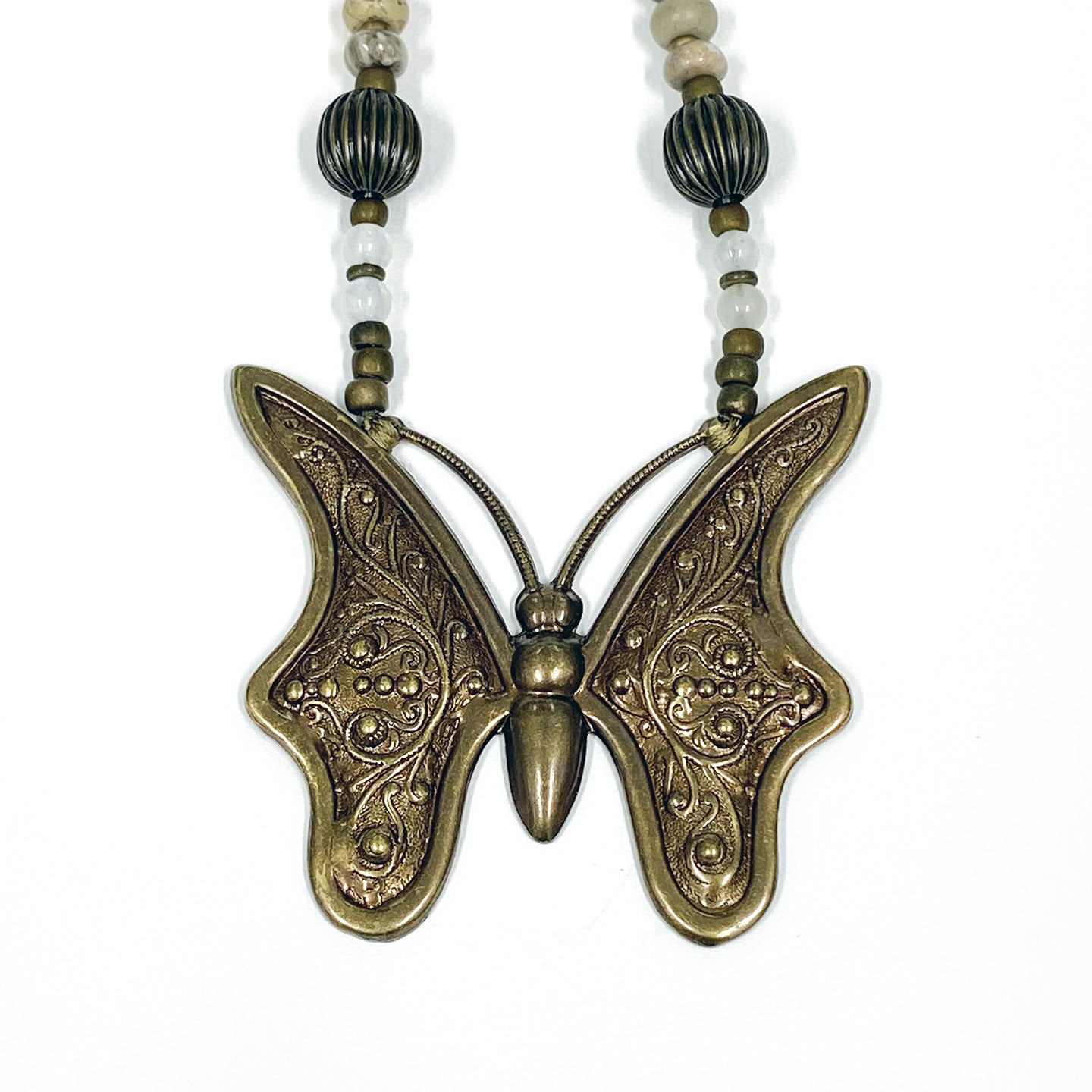 Petoskey Stone Necklace with a butterfly pendant by Michigan artist Janice Copperstone.