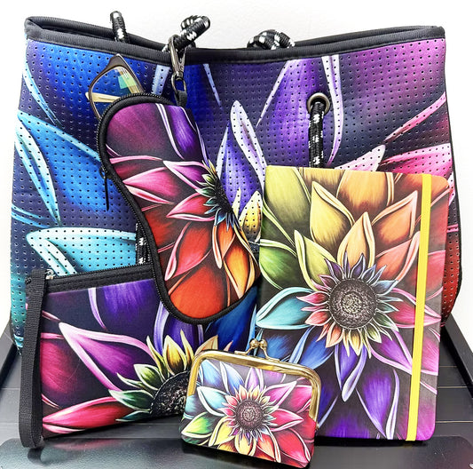 Colorful floral-patterned tote with shoulder straps by Denise Cassidy. Collect the set featuring sunglass pouch, journal and coin purse.