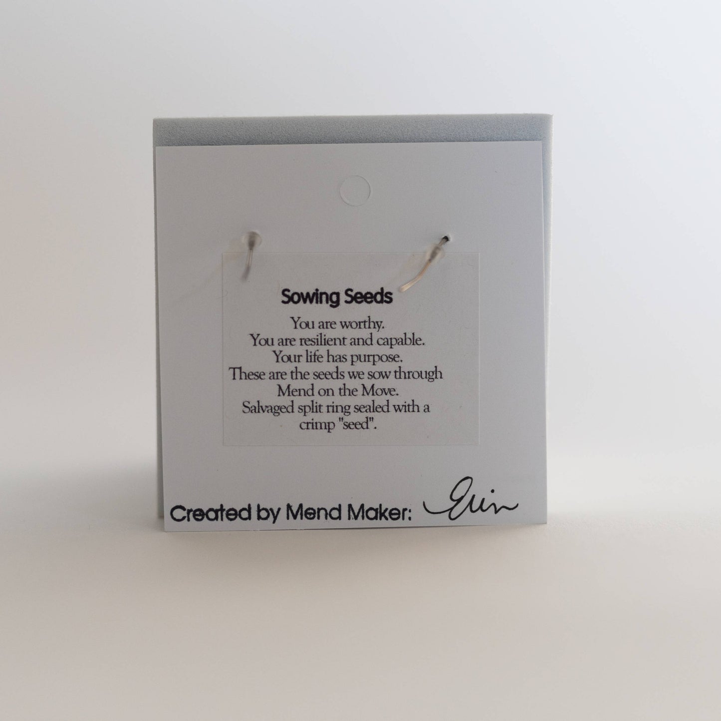 Earrings by Mend on the Move.Jewelry created from auto parts by abuse survivors in Detroit, Michigan.