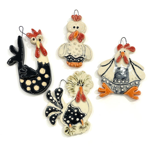 Set of four ceramic chicken ornaments by Jeanne DeHaan.