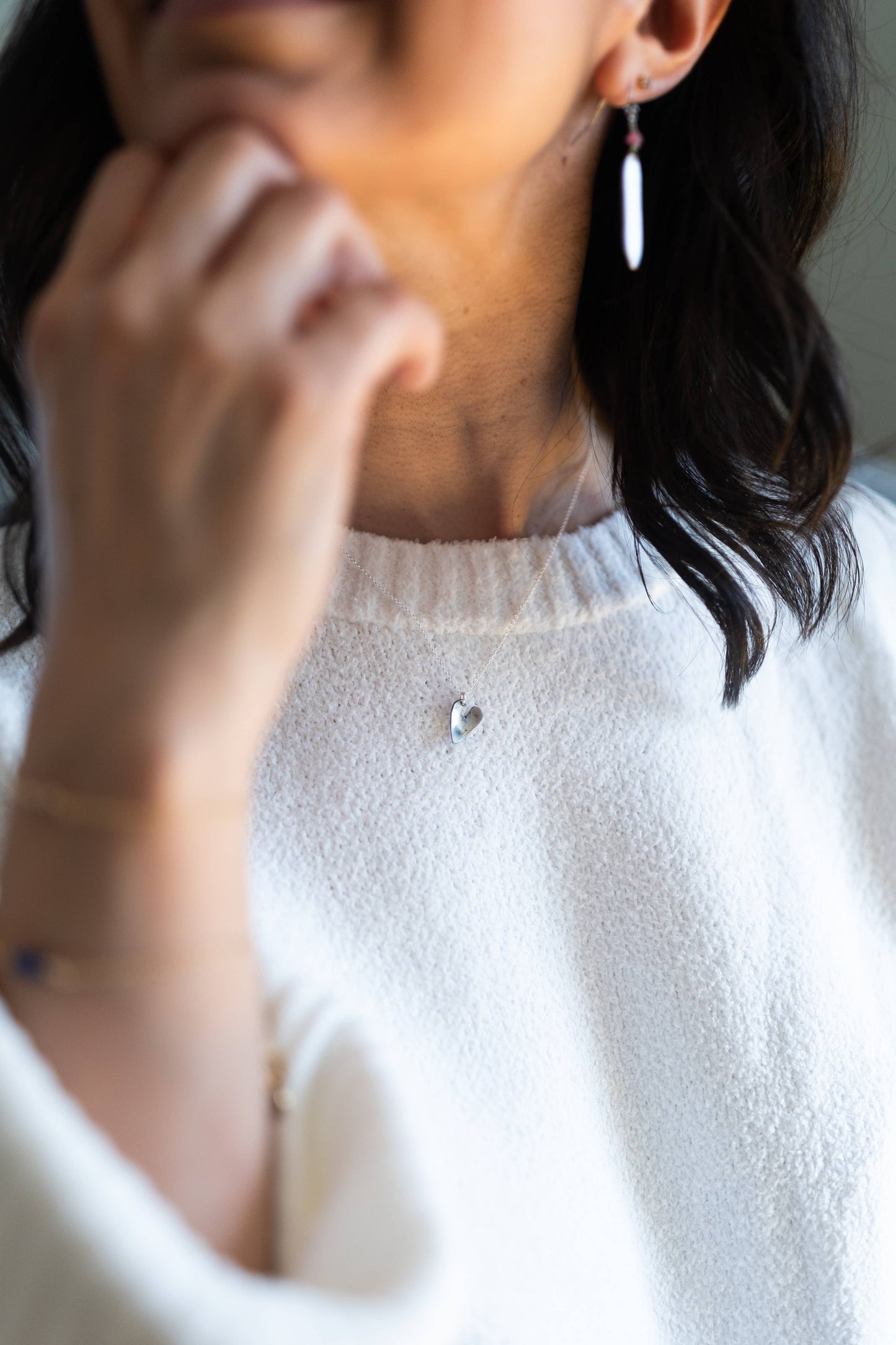 Necklace by Mend on the Move.Jewelry created from auto parts by abuse survivors in Detroit, Michigan.