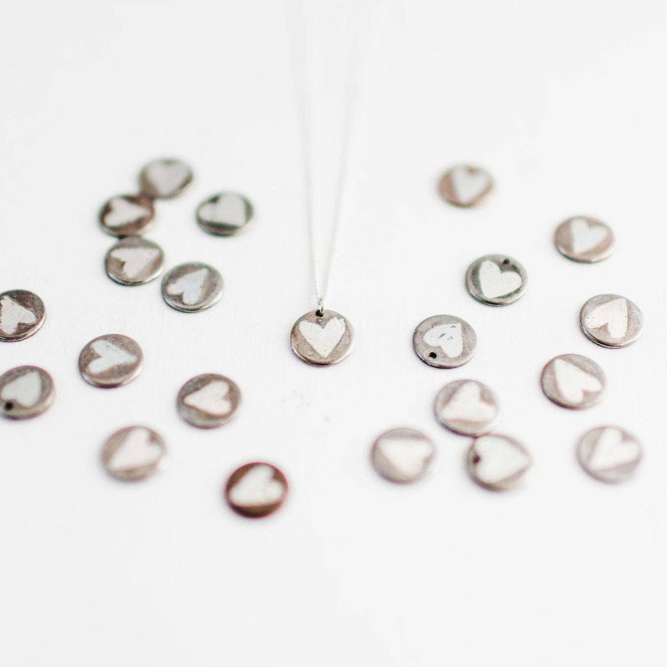 Tough Love necklace by Mend on the Move.Jewelry created from auto parts by abuse survivors in Detroit, Michigan.