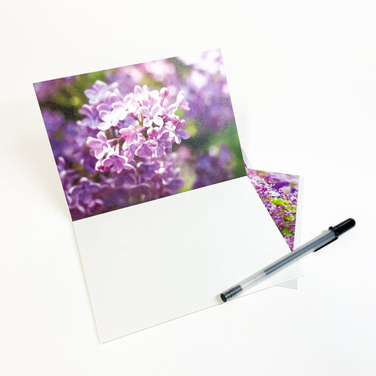 Blank greeting card featuring a photograph of Mackinac Island lilacs and a horse carriage at Marquette Park by local artist Jennifer Wohletz of Mackinac Memories.