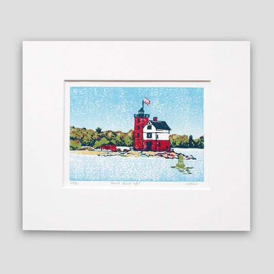 Nautical art created by Natalia Wohletz of Peninsula Prints, Mackinac Island. Round Island Light is a four-color linoleum block print of one of Michigan's most beloved lighthouses.