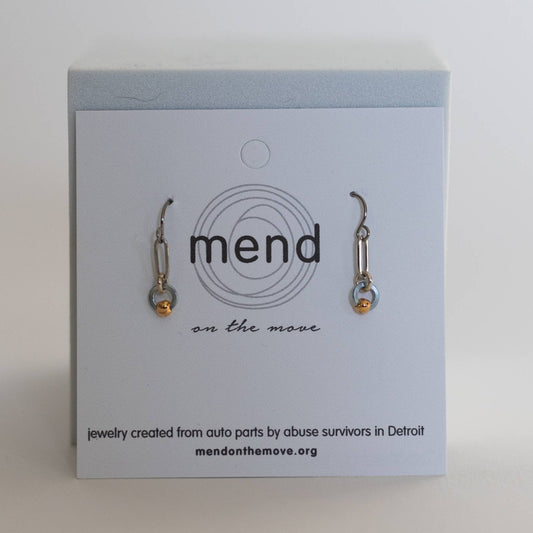 Earrings by Mend on the Move.Jewelry created from auto parts by abuse survivors in Detroit, Michigan.