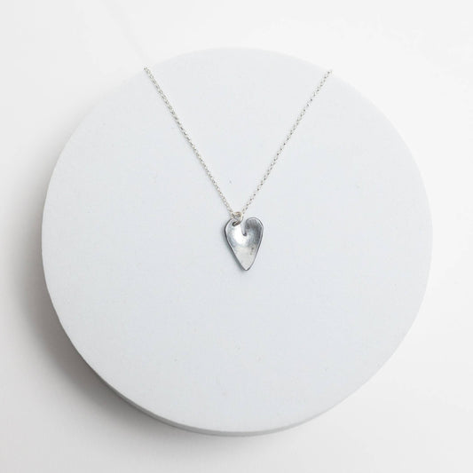 Necklace by Mend on the Move.Jewelry created from auto parts by abuse survivors in Detroit, Michigan.