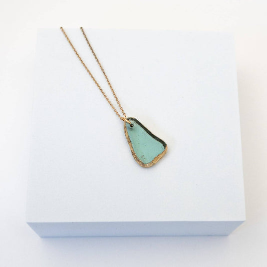 Necklace by Mend on the Move.Jewelry created from auto parts by abuse survivors in Detroit, Michigan.