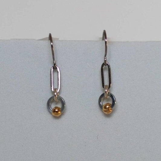 Earrings by Mend on the Move.Jewelry created from auto parts by abuse survivors in Detroit, Michigan.