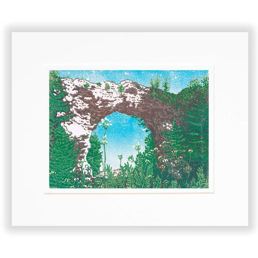 An eight-color 12" x 9" block print titled "Arch Rock" and inspired by the most iconic rock formation on Mackinac Island: Arch Rock. Matted in white.