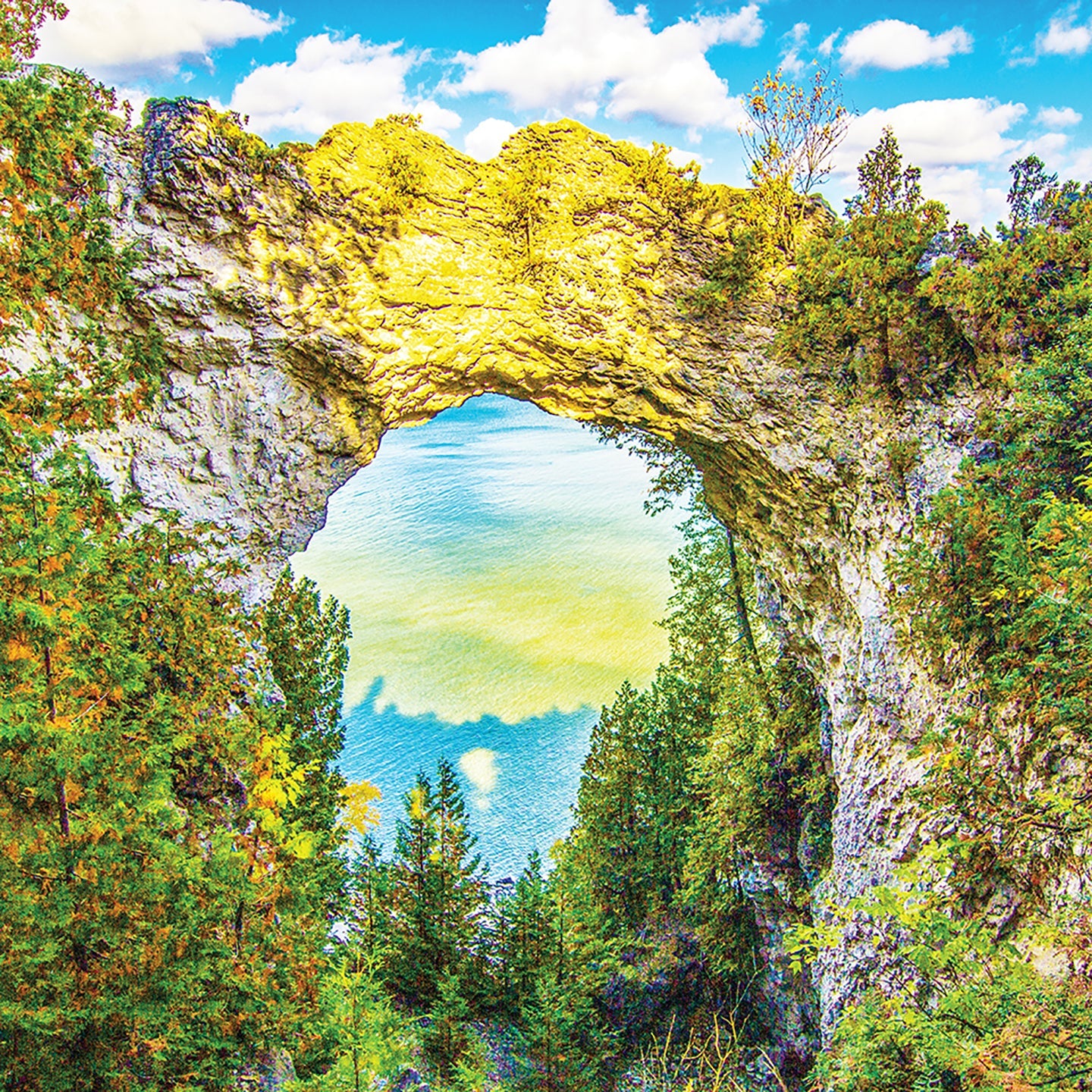 Mackinac’s most iconic scene, Arch Rock, is captured by Jennifer Wohletz with its shadow in the lake far below as the sun sets. 