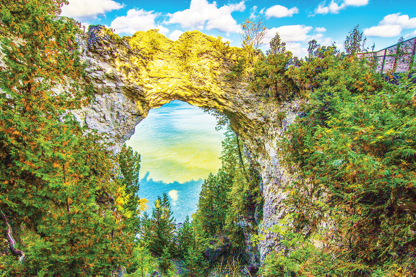 Mackinac’s most iconic scene, Arch Rock, is captured by Jennifer Wohletz with its shadow in the lake far below as the sun sets. 