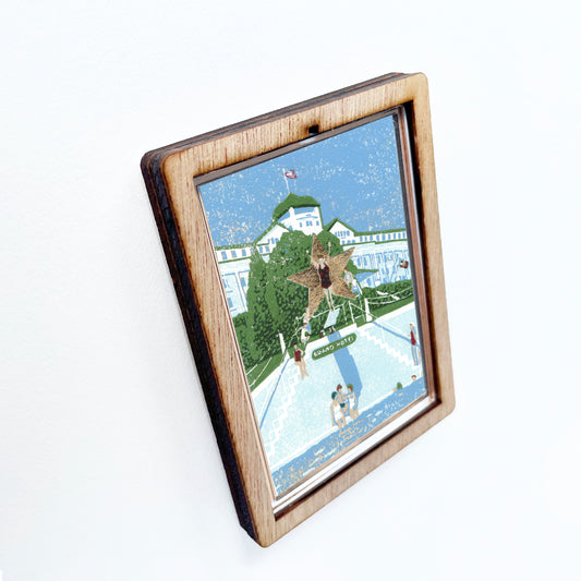 Decorative magnet featuring the block print, "Esther Williams, the Water Ballerina," by Peninsula Prints. The magnet has a protective clear coating and wooden frame.
