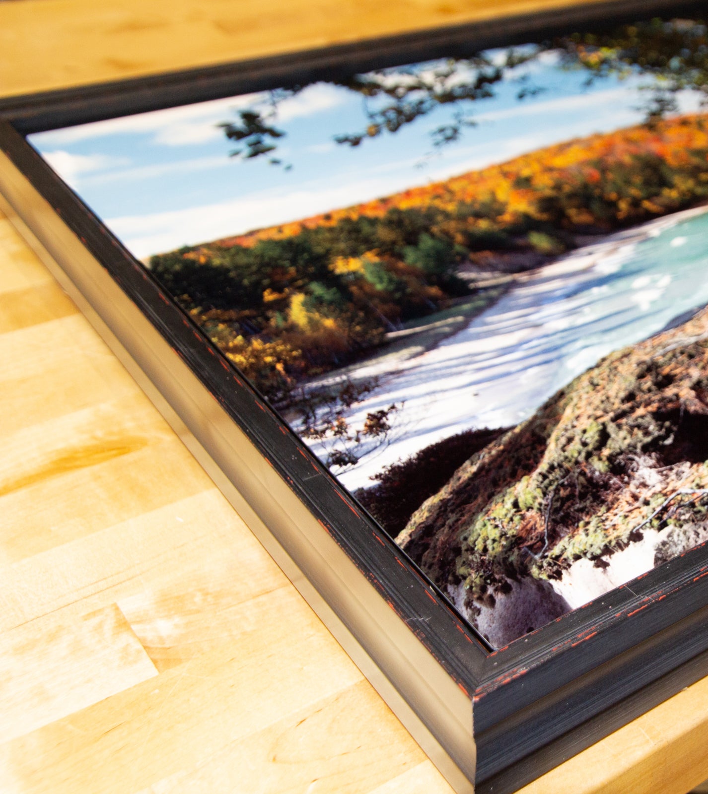 Photo printed on metal and mounted inside a floater frame.