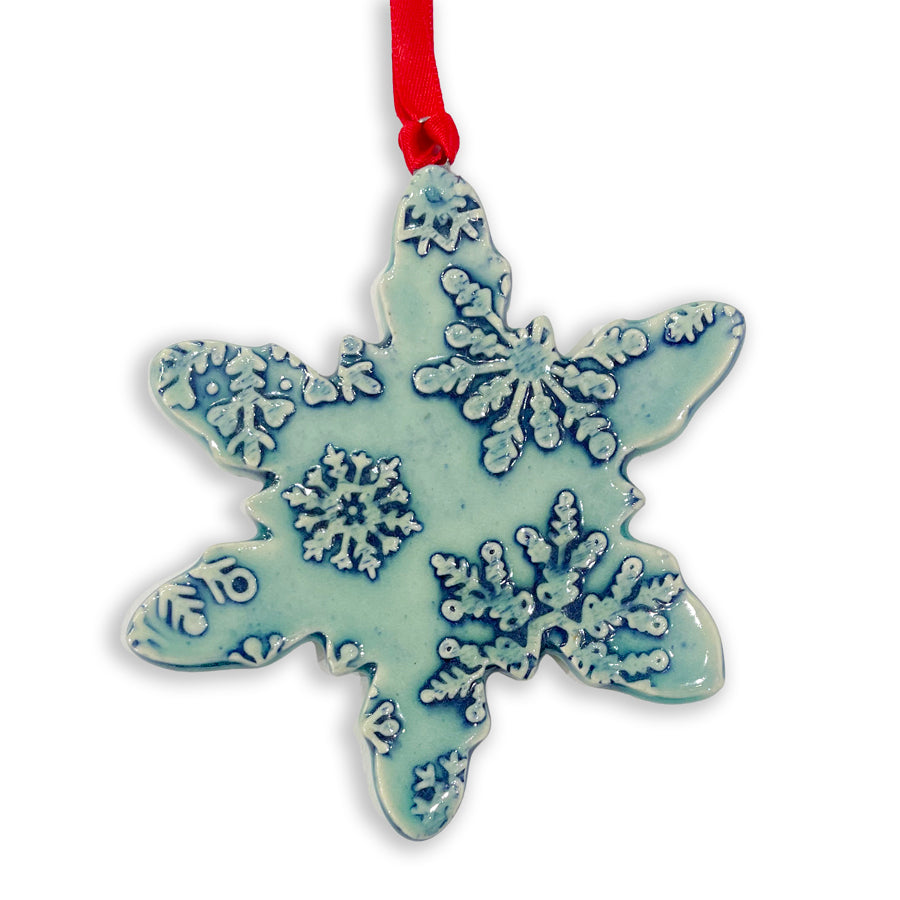 Handmade ceramic snowflake ornament created by Jeanne DeHaan of Milford, Michigan.&nbsp; Just like in nature, each snowflake is unique and no two are alike.