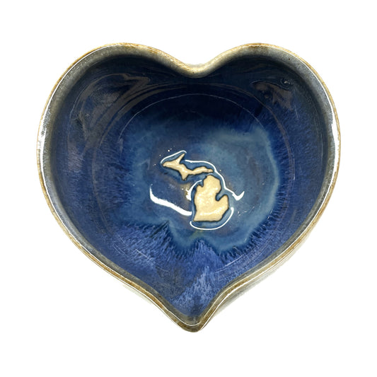 Heart-shaped blue ceramic bowl with a Michigan map in the center by Jeanne DeHaan.