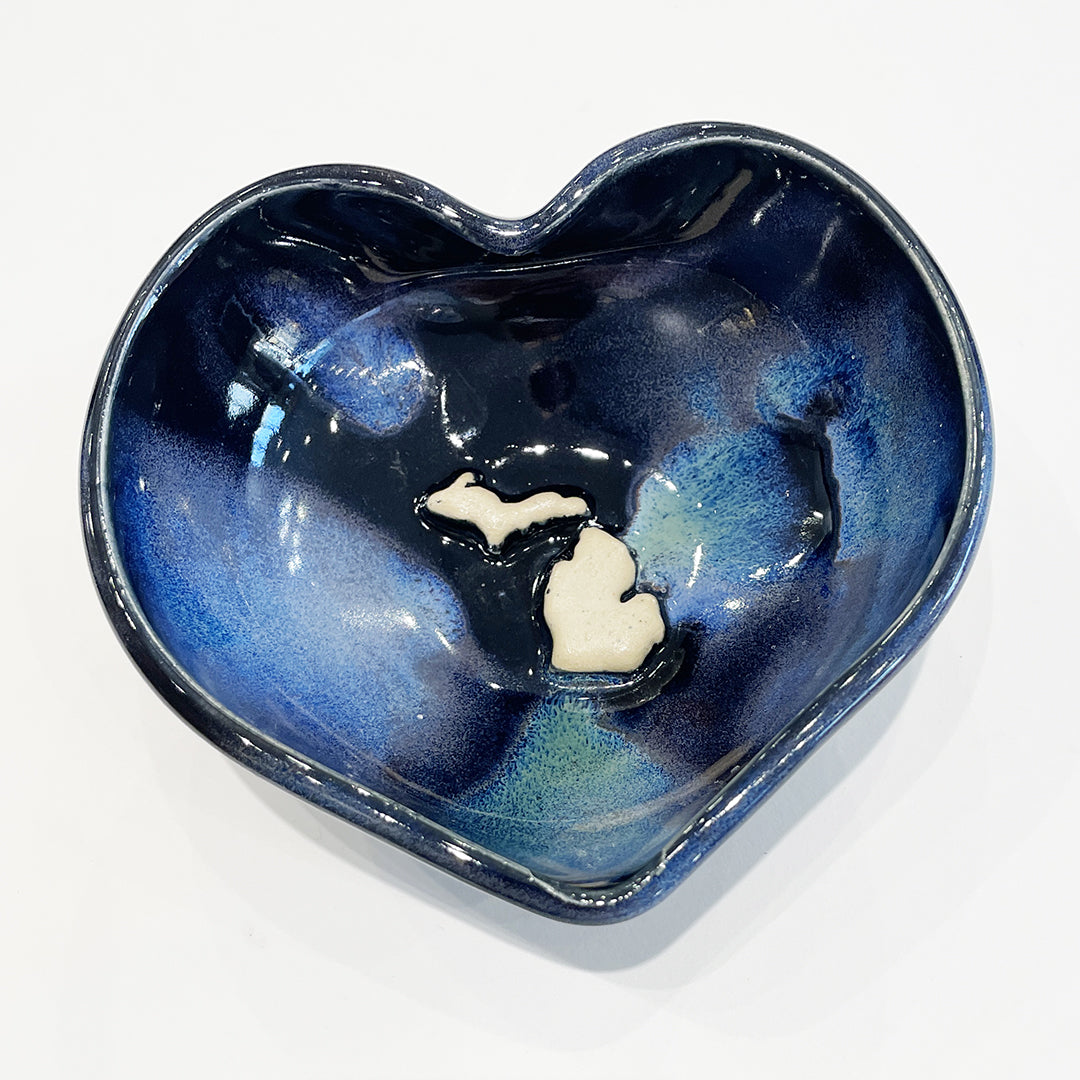 Handmade heart-shaped decorative bowl featuring the state of Michigan map with a Northern Lights Glaze by Jeanne DeHaan.