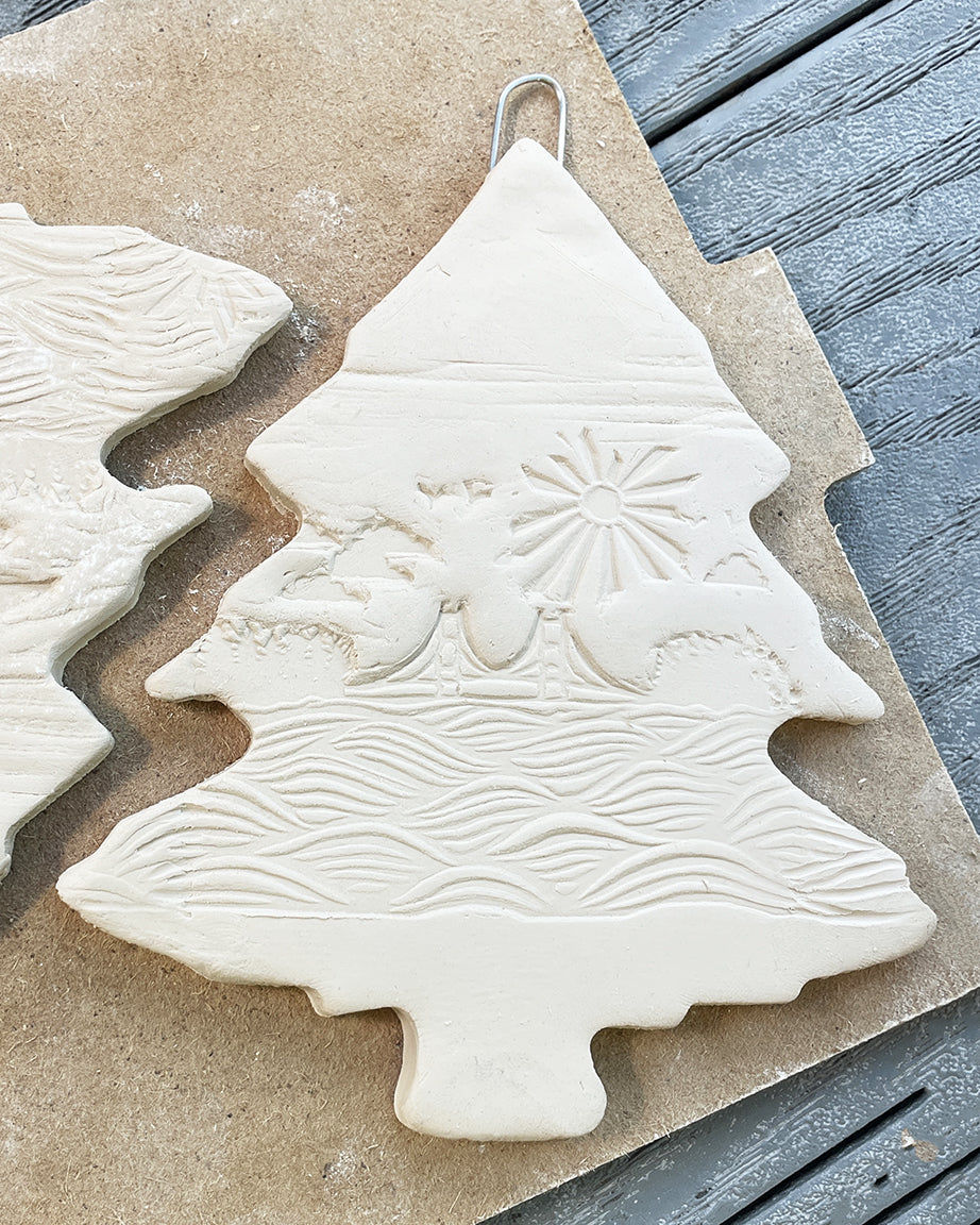 3" ceramic tree ornament featuring the Mackinac Bridge spanning the Great Lakes on a sunny day. Collaboration between Michigan artists Jeanne DeHaan and Natalia Wohletz.