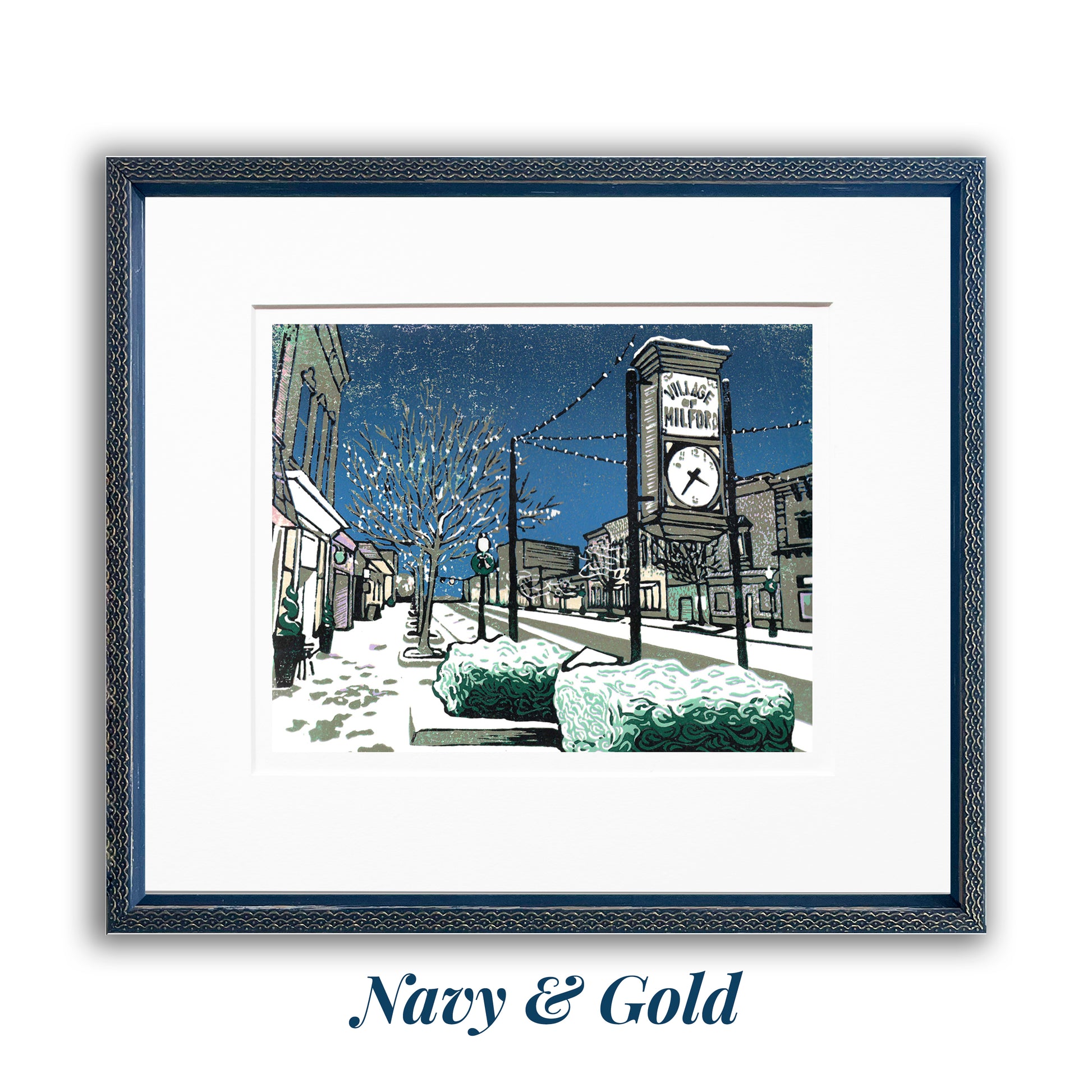 Framed artwork of a snowy street scene with a clock tower, framed in a  navy and gold frame. "Milford Lights" block print by Peninsula Prints featuring Milford, Michigan's Main Street during Christmastime.