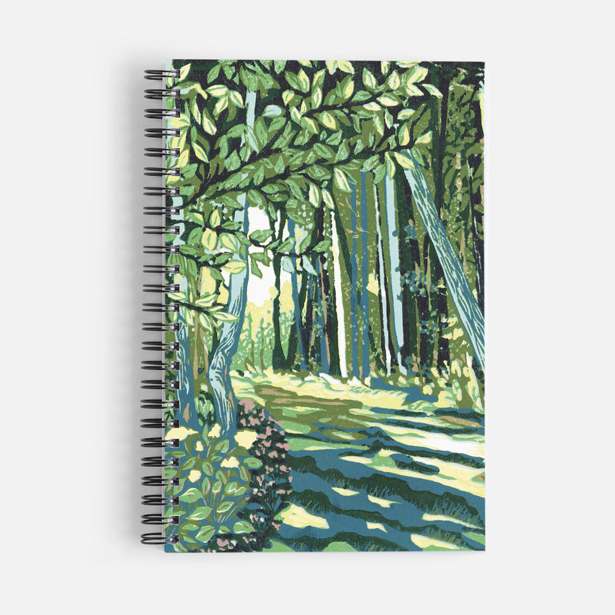 Spiral notebook featuring a block print design of a cedar trail by Natalia Wohletz of Peninsula Prints.
