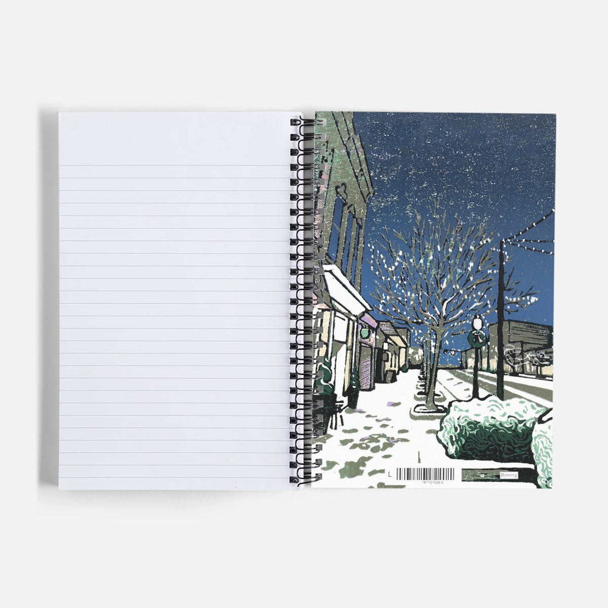 Journal/Notebook - featuring a small town Christmas block print design by Natalia Woheltz of Peninsula Prints on the inside back cover.
