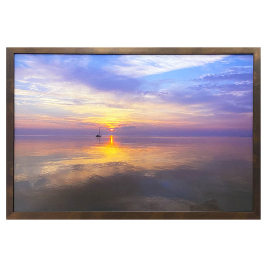 Straits Sunrsie framed photograh.  Photograph of a sailboat on the horizon as the sun rises over the Great Lakes by Jennifer Wohletz of Mackinac Memories.