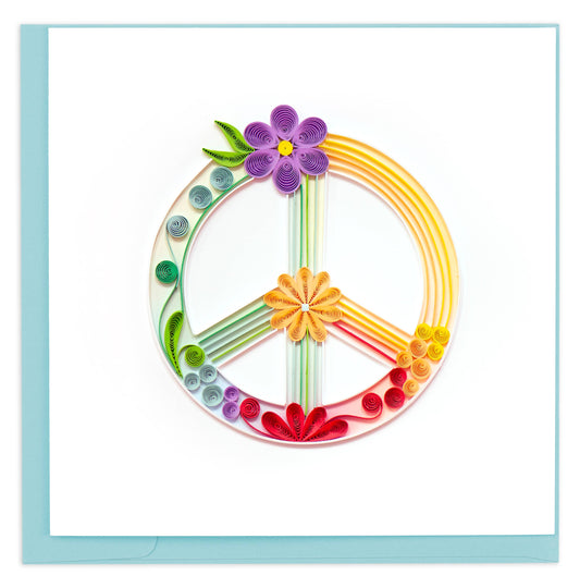 A handcrafted greeting card featuring a quilled peace sign design with green, yellow, and red lines and orange and purple flowers.