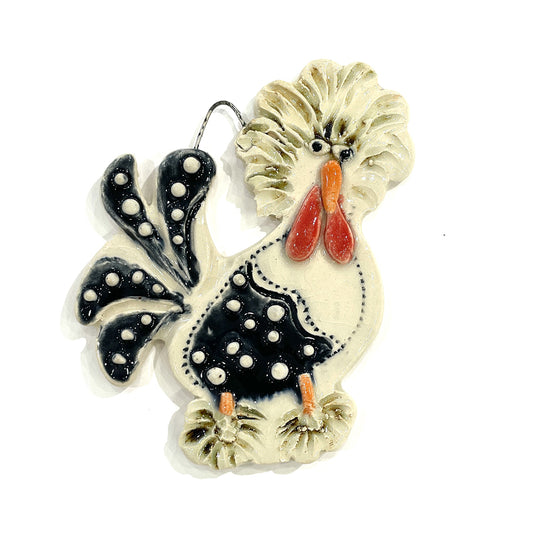 Decorative rooster ornament with black and white pattern on a white background