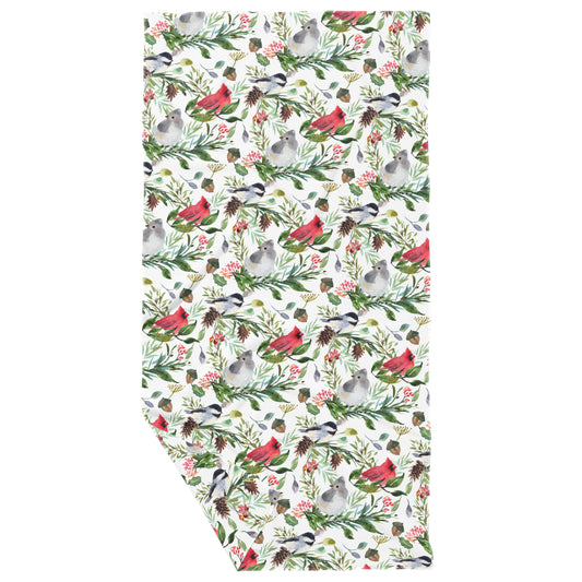 A double-sided kitchen towel with a pattern featuring various wild birds such as cardinals, chickadees, and bluebirds, along with festive foliage.