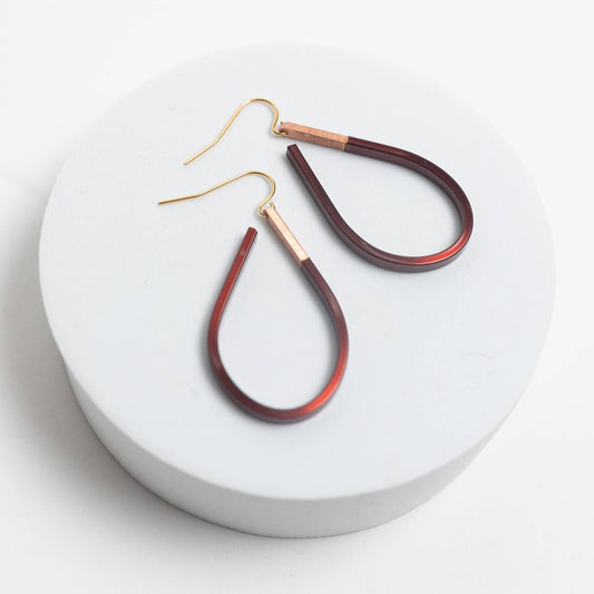 Copper earrings by Mend on the Move.Jewelry created from auto parts by abuse survivors in Detroit, Michigan.