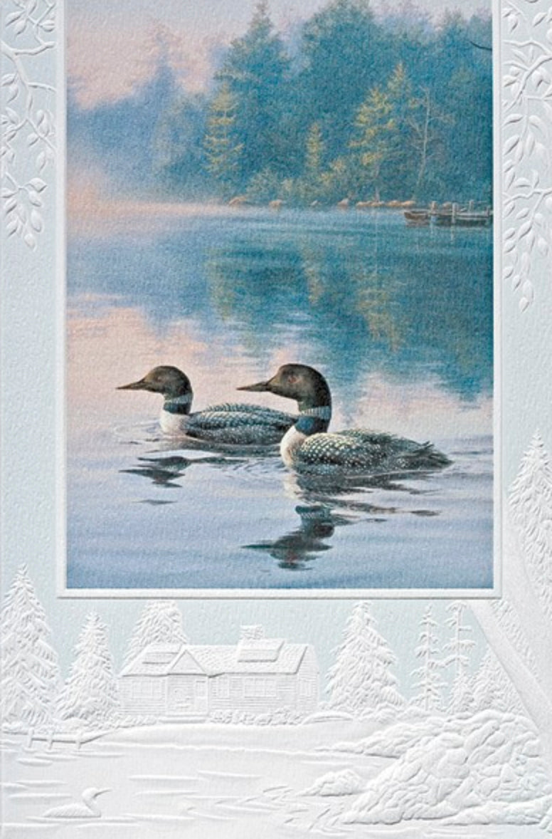 An embossed birthday card featuring loons on a misty pond.  Artwork by Darrell Bush. Pumpernickel Press cards are made in the USA using agricultural-based inks. 