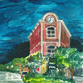 Flat Iron Building is an original watercolor by Michigan Artist Janic Dumas. The piece depicts a popular building and village garden featuring a water wheel sculpture by Heiner Hertling in Milford, Mich. This small piece looks great on an easel or may be framed.