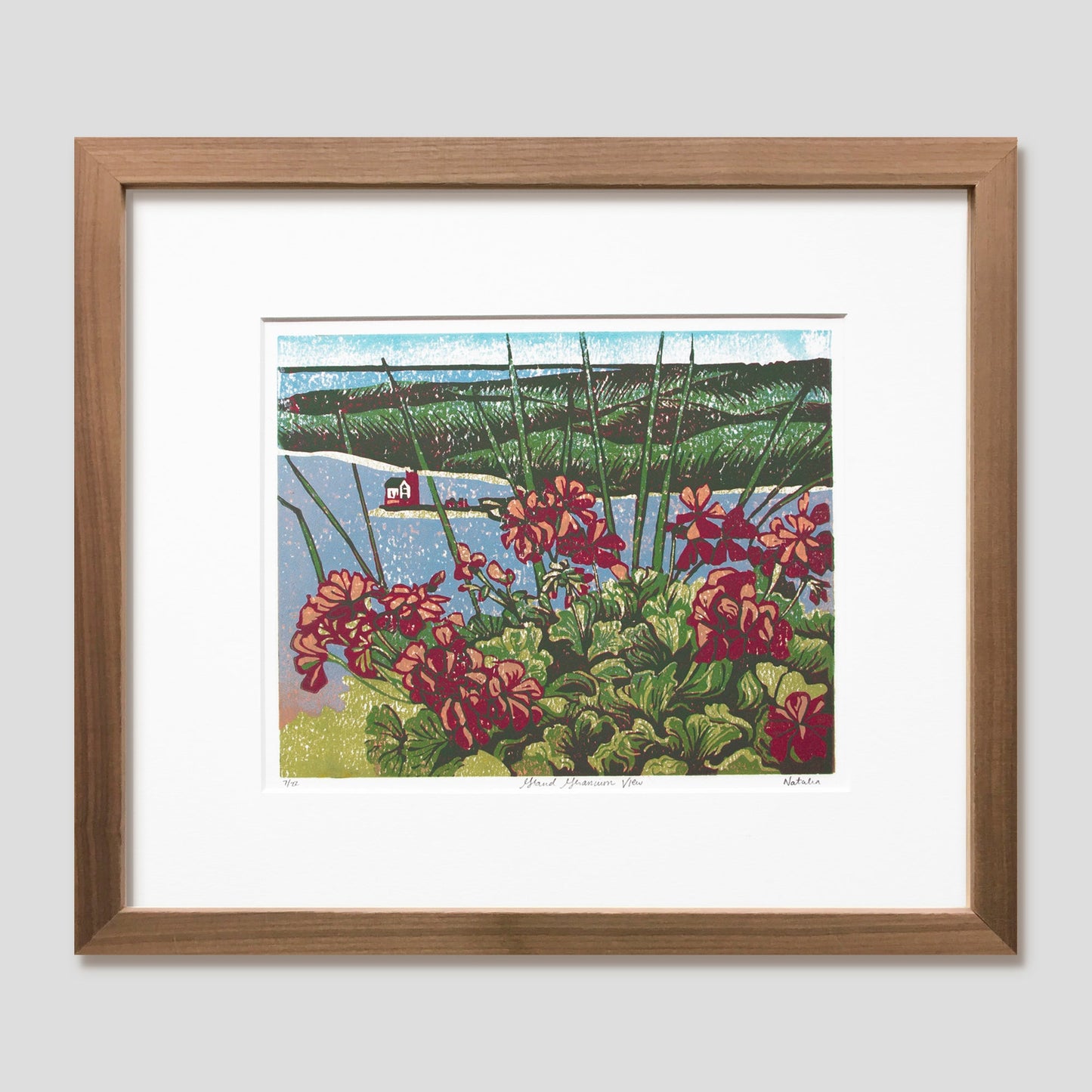 Grand Hotel art featuring the view of Round Island Lighthouse from the hotel's geranium-lined porch by printmaker Natalia Wohletz of Peninsula Prints titled Grand Geraniums.