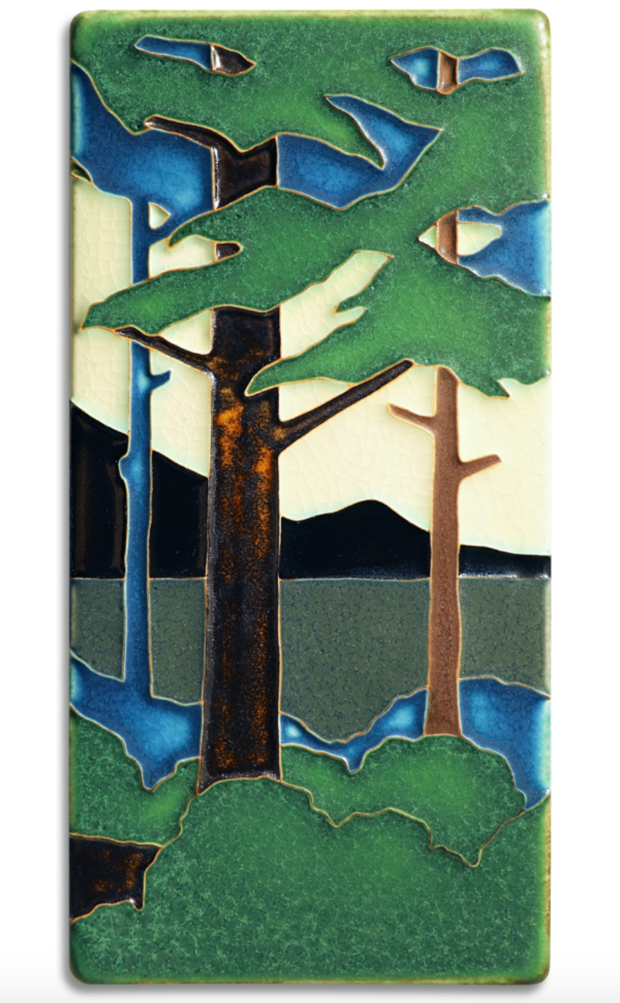 Motawi's Pine Landscape series is adapted from Grueby Faience designer Addison LeBoutillier's tile "Pines." This tile was Motawi's first attempt at polychrome work and is most recognized as a Motawi signature series.