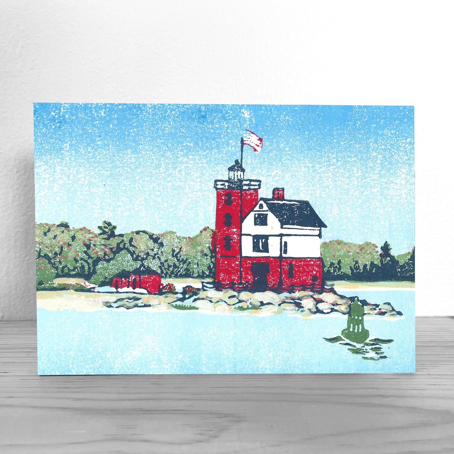 This giclée is a fine art reproduction of a linoleum block print by Natalia Wohletz of Peninsula Prints inspired by Round Island Lighthouse located near Mackinac Island, Michigan. 