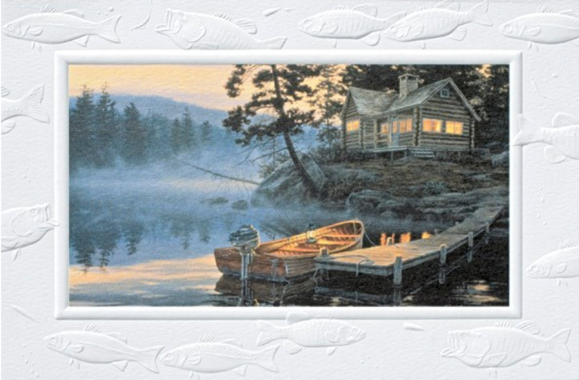 An embossed birthday card featuring a boat tied to a lake dock near a log cabin.  Artwork by Darrell Bush.