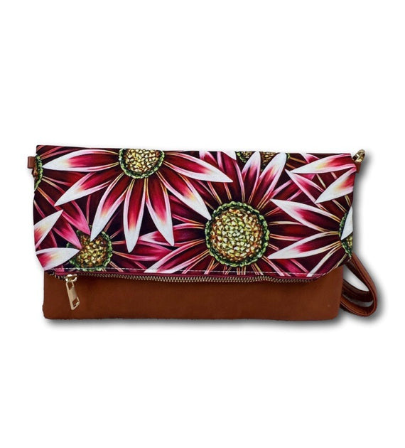 This versatile crossbody by Denise Cassidy Wood of DCW Inspired acts as two bags in one. Attach the crossbody strap for a stylish crossbody bag or remove it and dress up your evening with a fun little clutch.