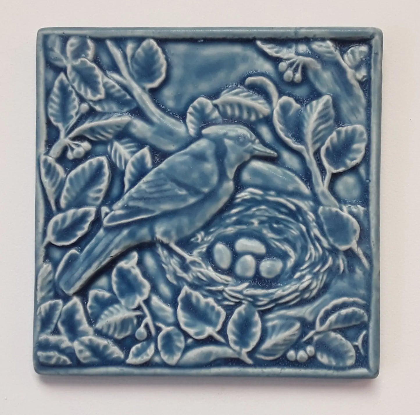nesting blue jay whistling frog ceramic art tile